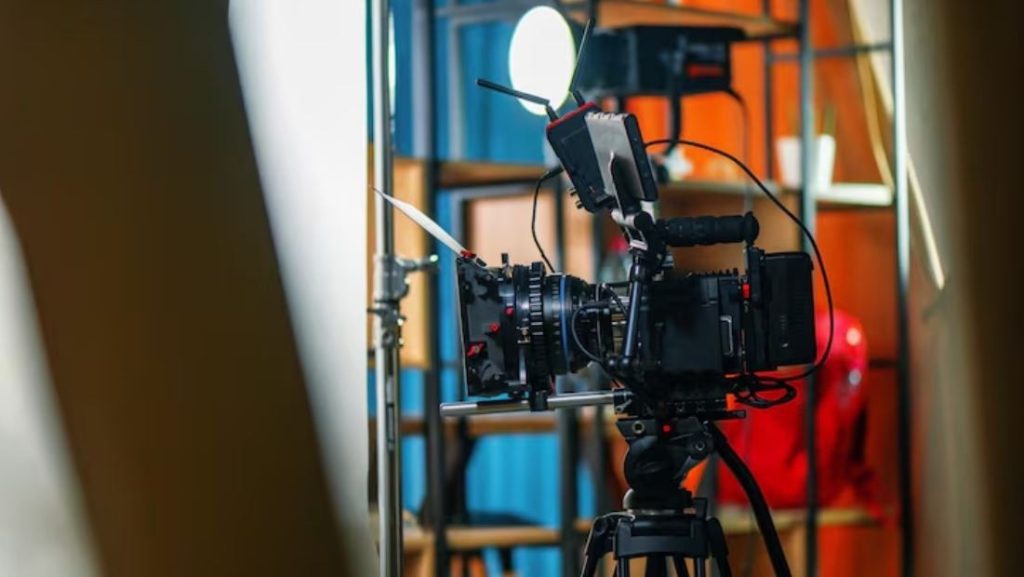A professional video camera and lighting setup on a commercial set, representing the services of a Commercial Video Production Company in Woodbridge