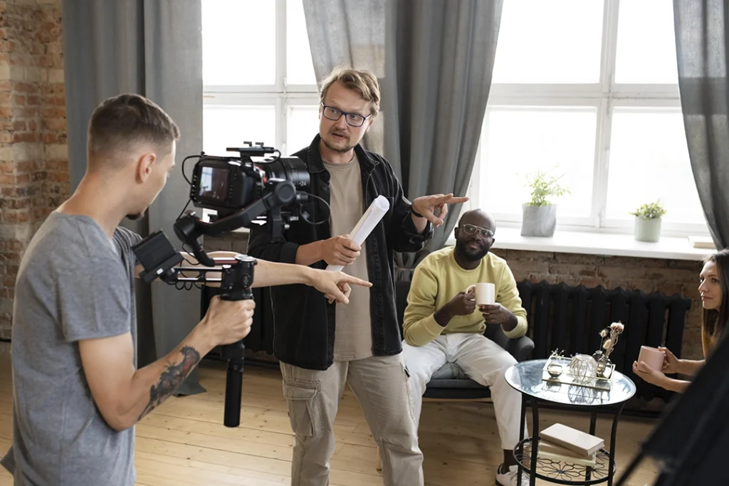 Commercial video production company Sugar Land: Director filming actor in vibrant office setting at UTurn Productions, ensuring high-quality commercial content in Sugar Land.