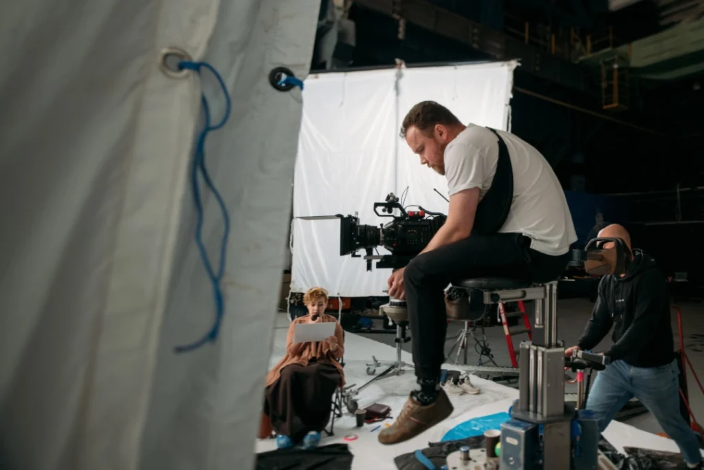 Studio team films talent using advanced rig for commercial video production Sugar Land with controlled lighting setup.