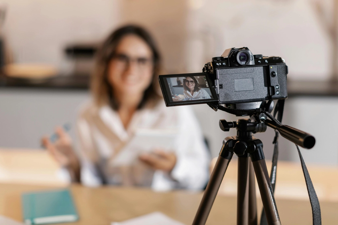  High-quality camera recording a professional woman—hire a top corporate video production agency Sugar Land.
