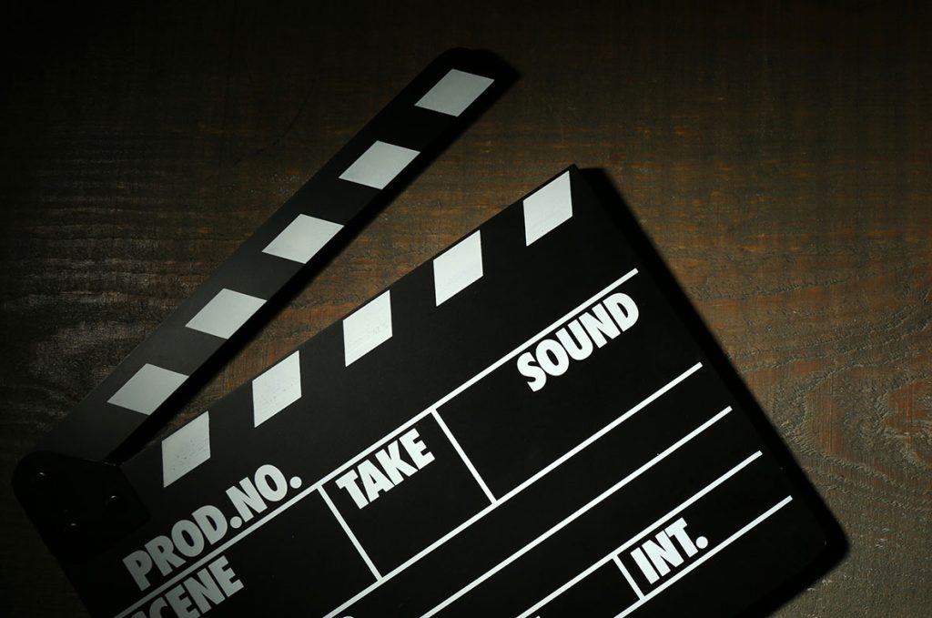 Clapperboard marking the start of a new scene for promotional videos production Sugar Land marketing.