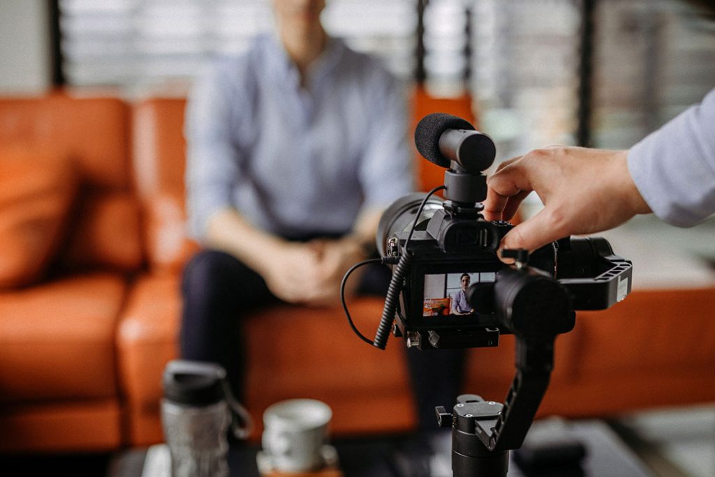 Strategy session on set for high-impact promotional videos company Sugar Land content that goes viral.