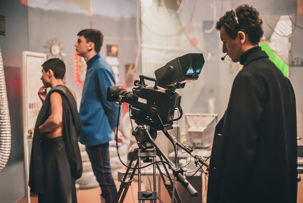 Director and crew on set with a professional camera from promotional videos agency Sugar Land.