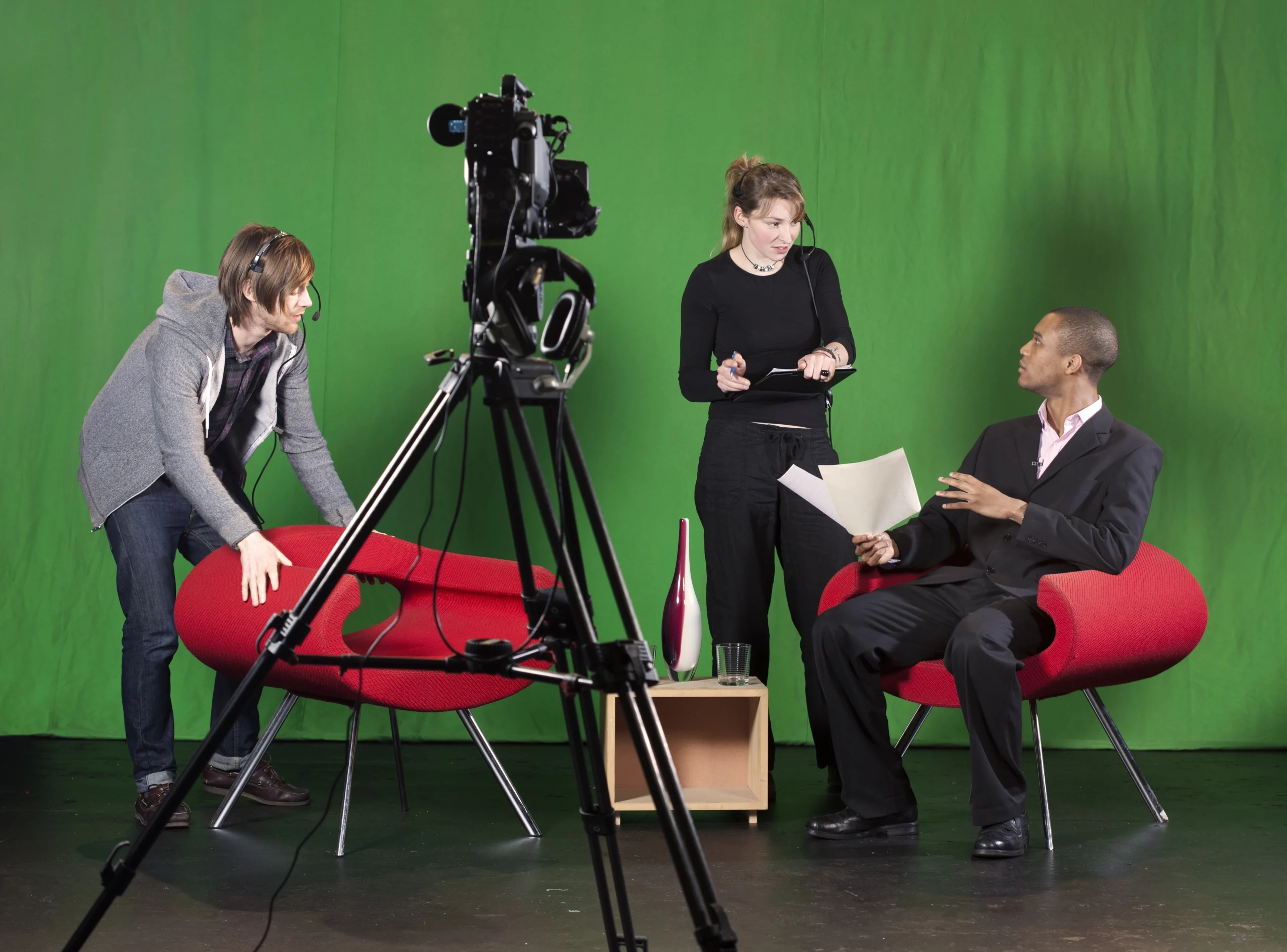Top-rated video production studio Sugar Land team instructing a client during a professional filming session