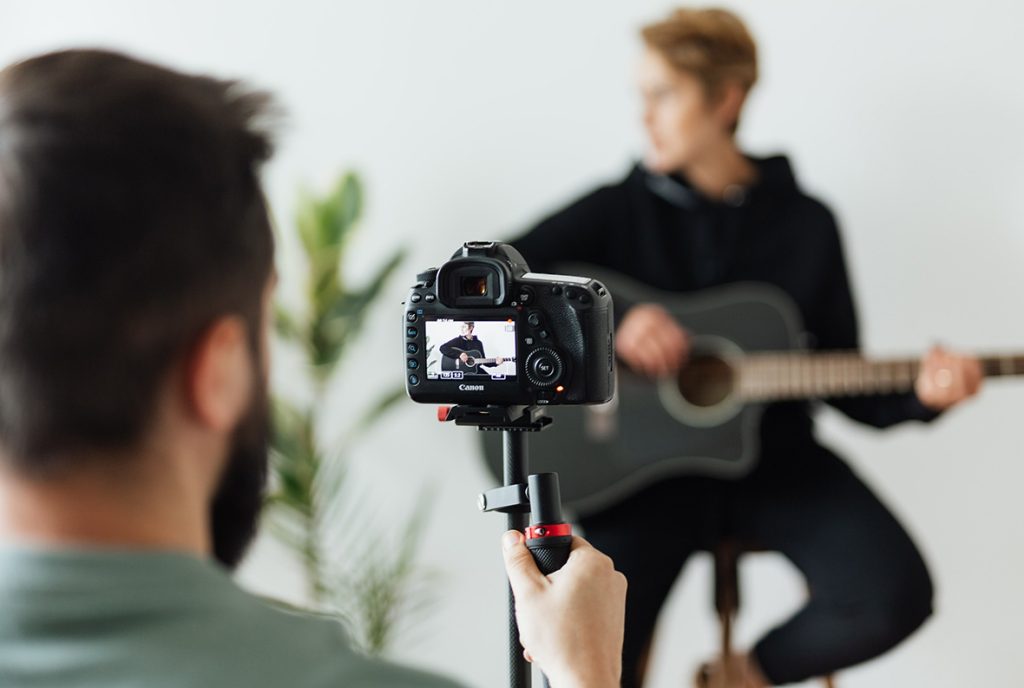 Promotional videos production Sugar Land studio shoot for a musician's creative content.