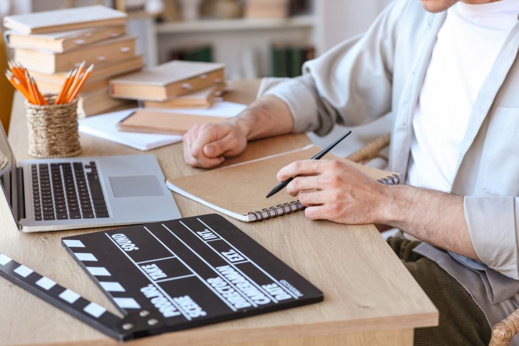 Scriptwriter creating content for a client at a corporate video production company Sugar Land.