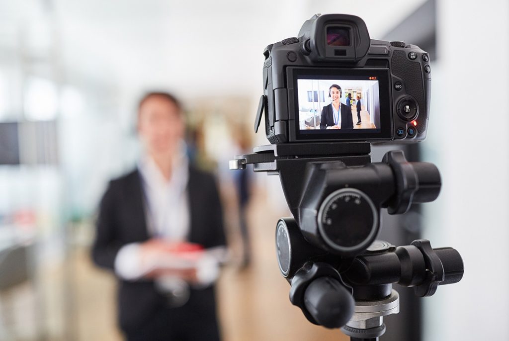 Business videos agency Sugar Land capturing a professional corporate interview with a businesswoman in an office.