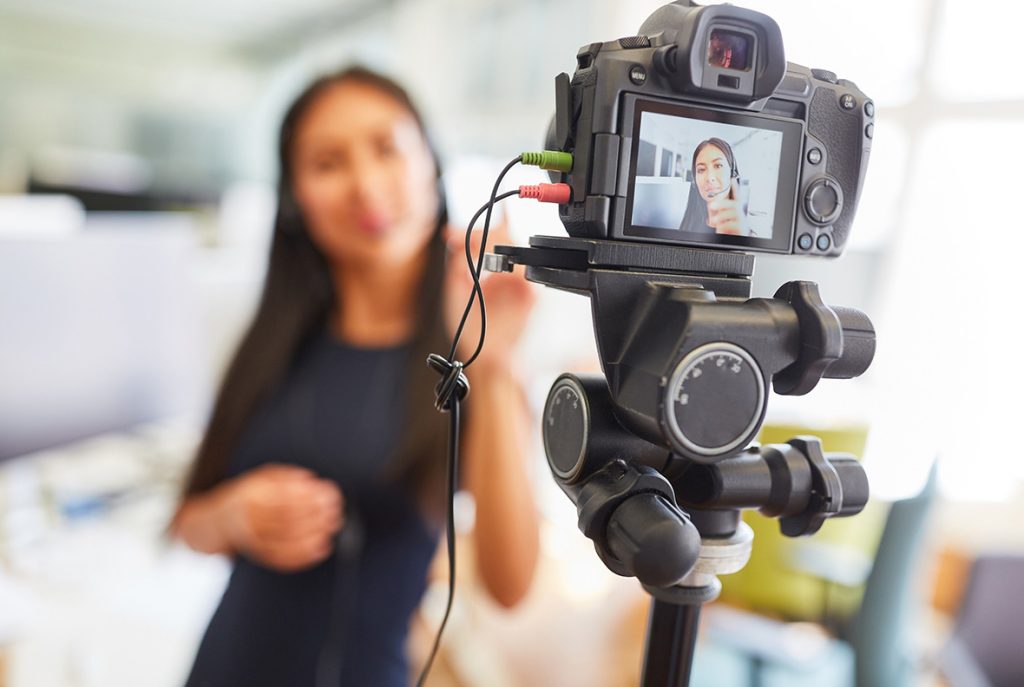 Business videos agency Sugar Land recording a female influencer wearing a headset for a social media video shoot.