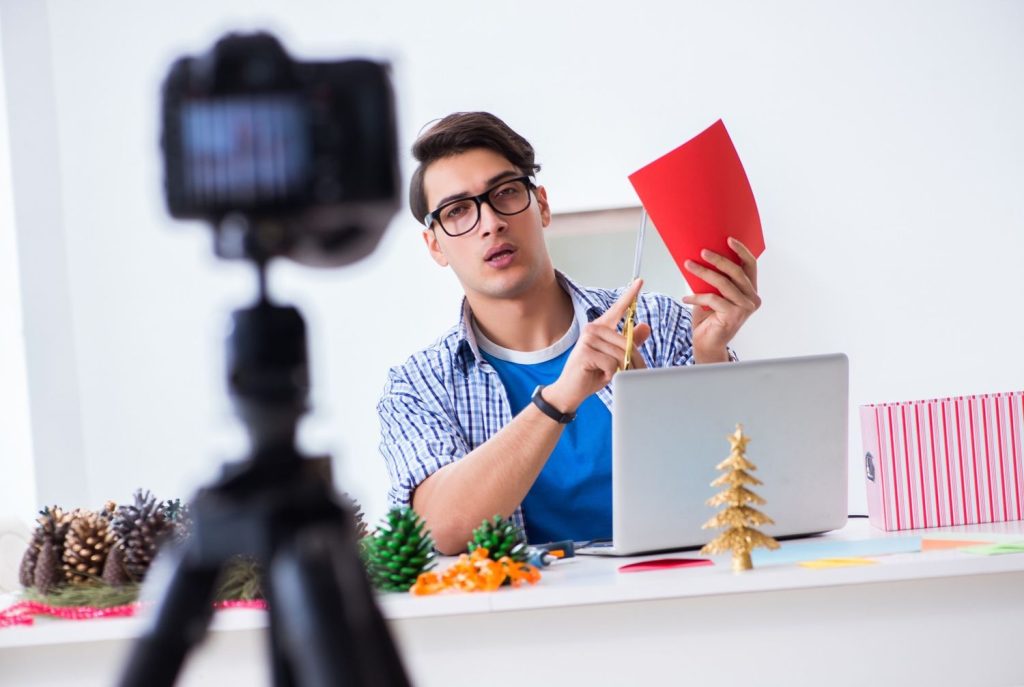 DIY expert hosting a workshop with a business videos company Sugar Land for creative holiday content and tutorials.
