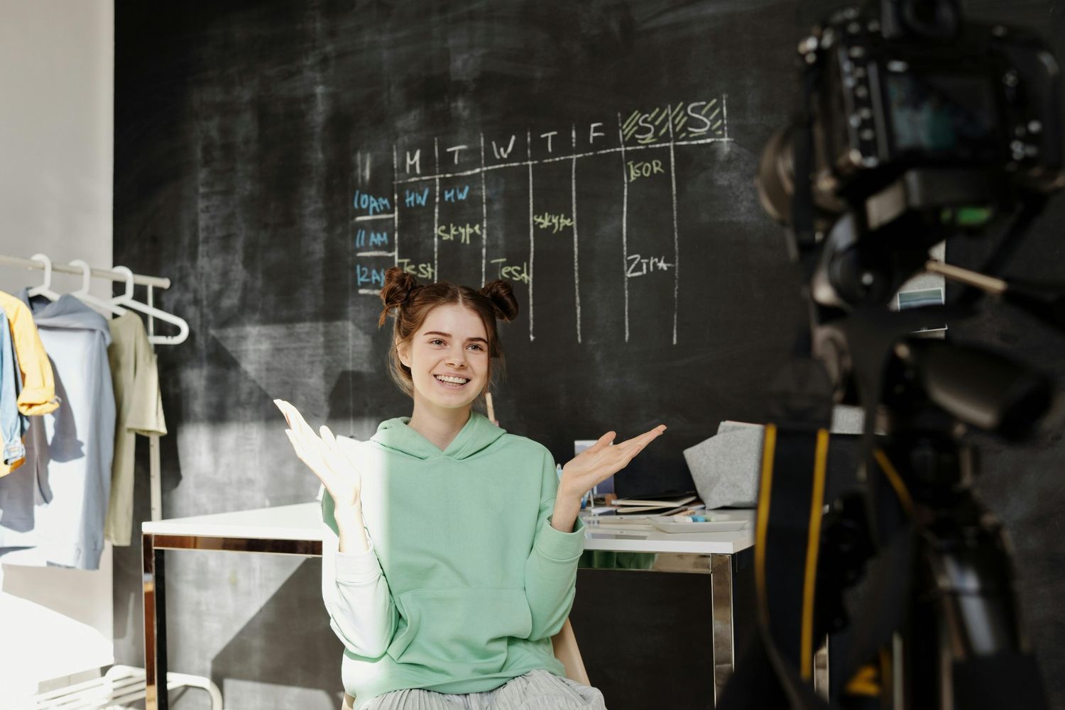 Creative content creator filming vlog for business videos production Sugar Land using a professional camera.