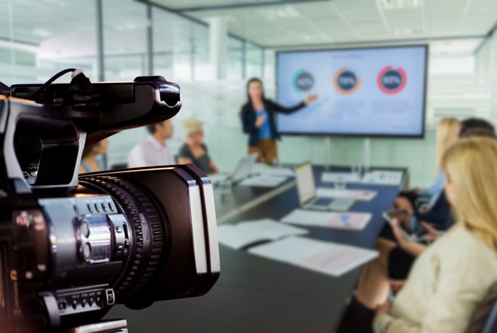Professional conference filming by a corporate video production agency Sugar Land, capturing a business presentation.