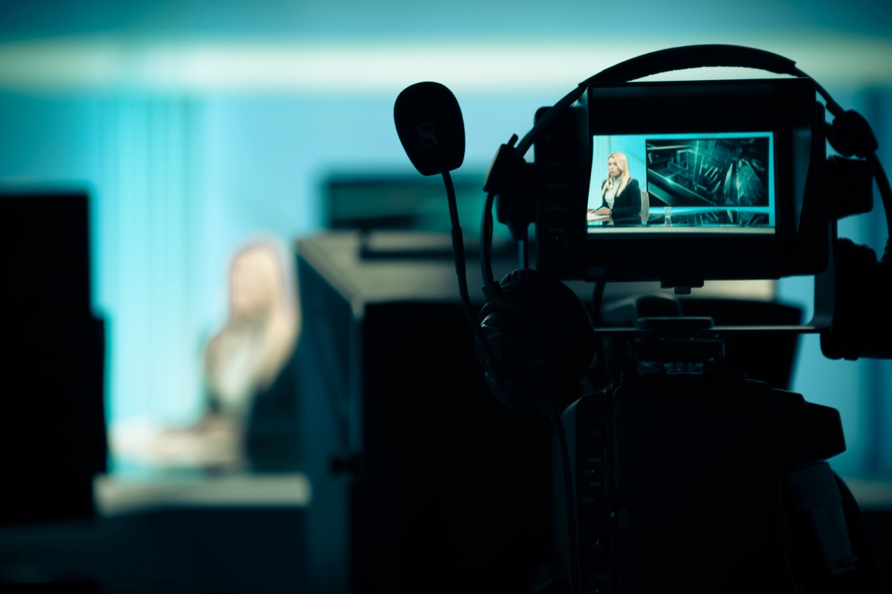 Broadcast studio camera monitor showing a news anchor, managed by a top-tier video production company Sugar Land.