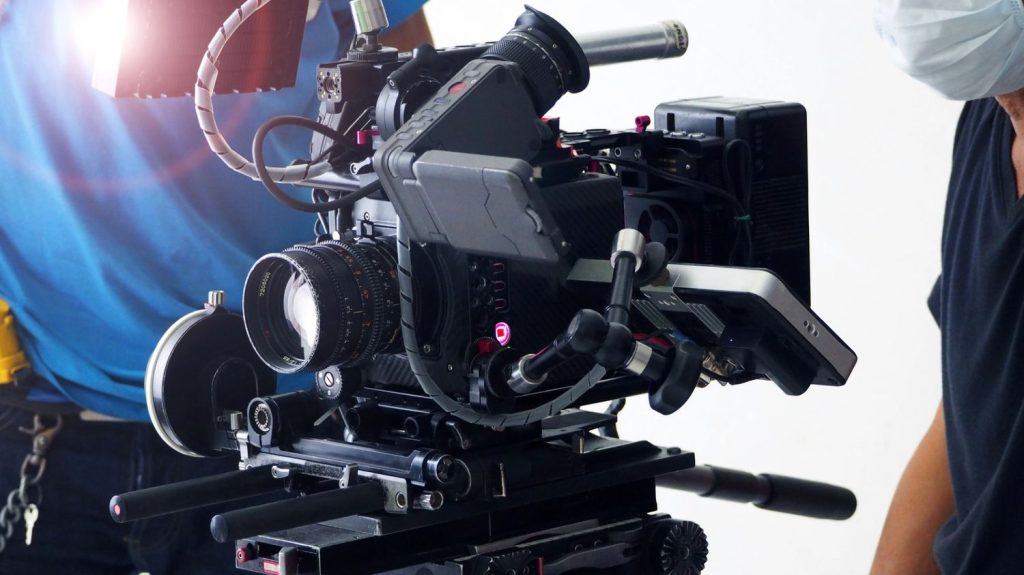 Professional film crew using a high-end camera rig for commercial video production Sugar Land studio services.