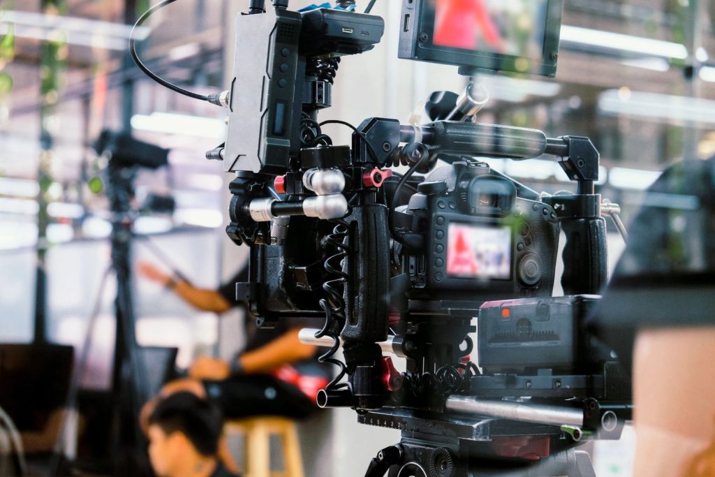 Advanced cinema gear used for industrial video production Sugar Land, featuring a tripod-mounted camera and monitor.