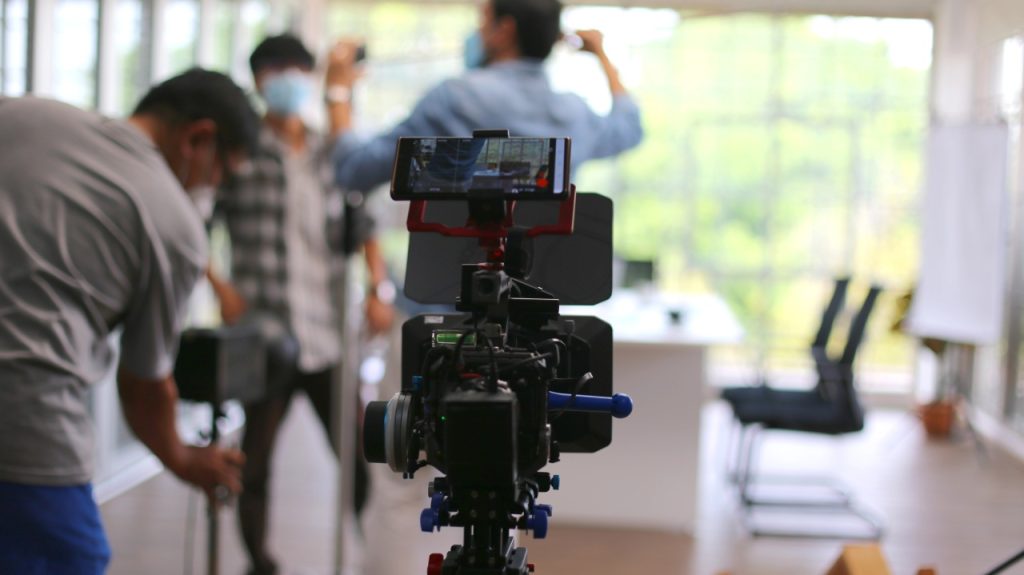 Expert film crew on set during a shoot for a premier corporate video production company Sugar Land professional.