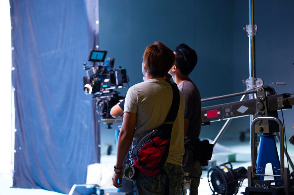 Professional film set with camera equipment and crew managed by a top video production company Sugar Land.