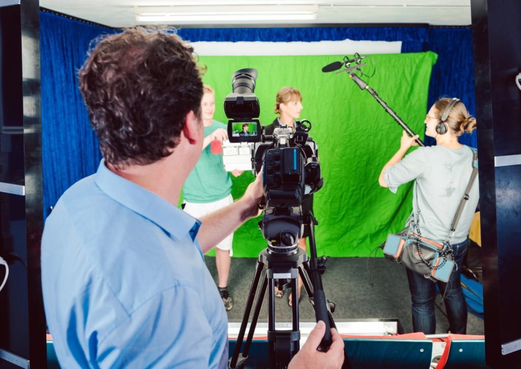 High-end green screen studio at a commercial video production company Sugar Land, equipped with professional stage lighting.