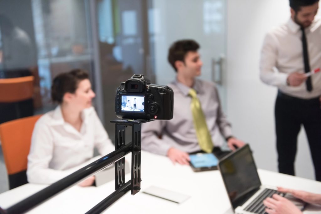 DSLR camera filming a professional office interview for a corporate video production company Sugar Land digital project.