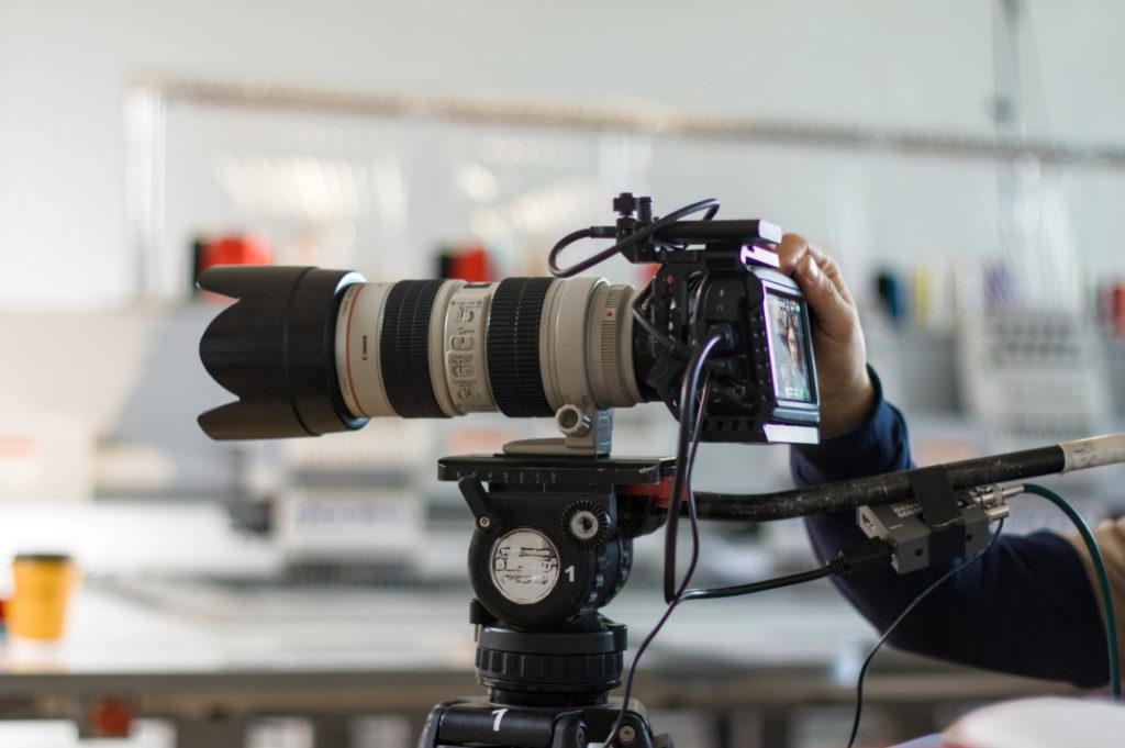 Close up of professional camera gear for corporate video production Sugar Land featuring a high-end cinema lens.