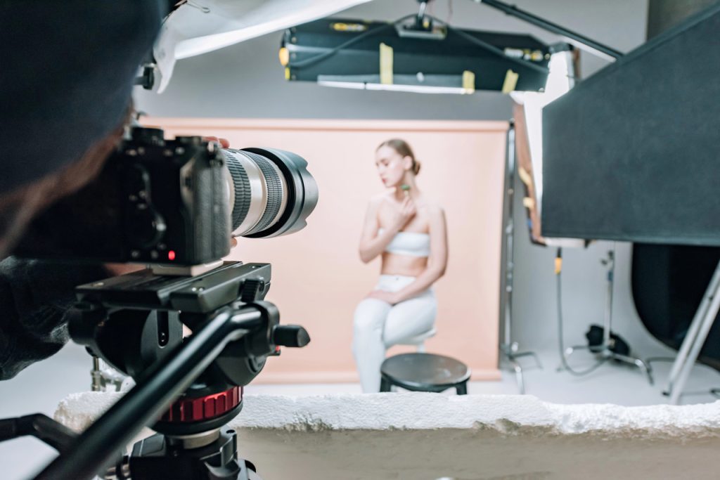 Behind the scenes studio production by a promotional videos agency Sugar Land featuring a model and pro lighting.