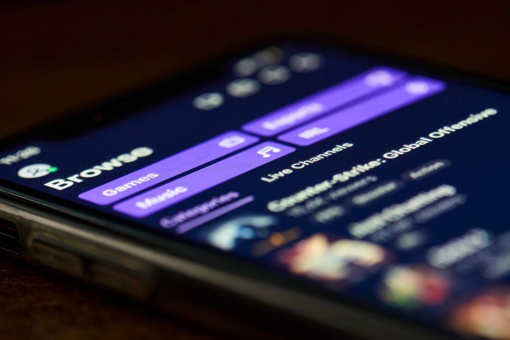 Mobile app interface showcasing commercial video production Sugar Land live channels for gaming and music streaming. 