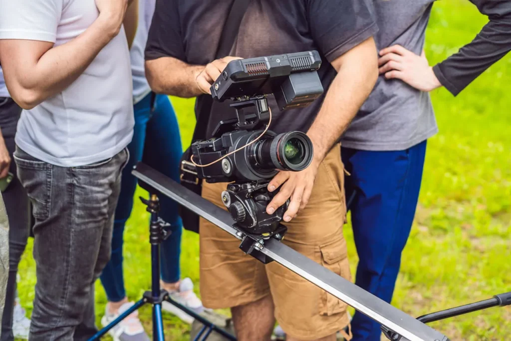 On-location commercial video production company sugar land crew using a camera slider for smooth, professional footage.